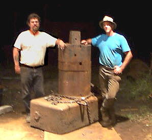 Bruce Wallace with Josh Greenwood next to 12,000 pound anvil for a 750 pound air hammer!
