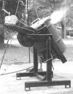 Cover photo detail of tilting furnace while firing - Click for enlargement