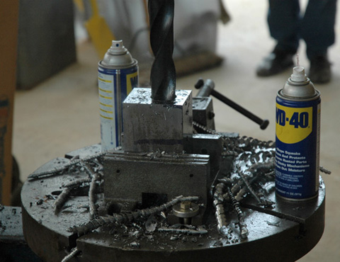 Wilton drill press vise in use on 25 in. Champion dril press and two cans of WD-40.
